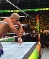 WWE_Money_In_The_Bank_2023_Rhea_Ringside_Attacks_Cody_1817.jpg