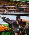 WWE_Money_In_The_Bank_2023_Rhea_Ringside_Attacks_Cody_1902.jpg