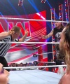 WWE_Raw_05_29_23_Rhea_Ringside_Seth_Puts_Arm_On_Rhea_457.jpg