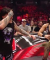 WWE_Raw_05_29_23_Rhea_Ringside_Seth_Puts_Arm_On_Rhea_496.jpg