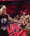 WWE_Raw_05_29_23_Rhea_Ringside_Seth_Puts_Arm_On_Rhea_497.jpg