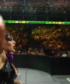 WWE_Money_In_The_Bank_2023_Rhea_Ringside_Attacks_Cody_1602.jpg