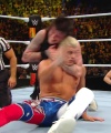 WWE_Money_In_The_Bank_2023_Rhea_Ringside_Attacks_Cody_1616.jpg